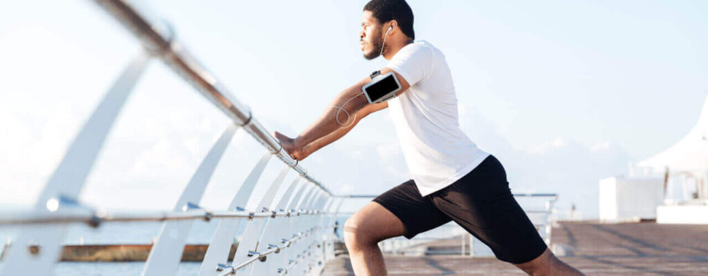A man stretching before and after workout